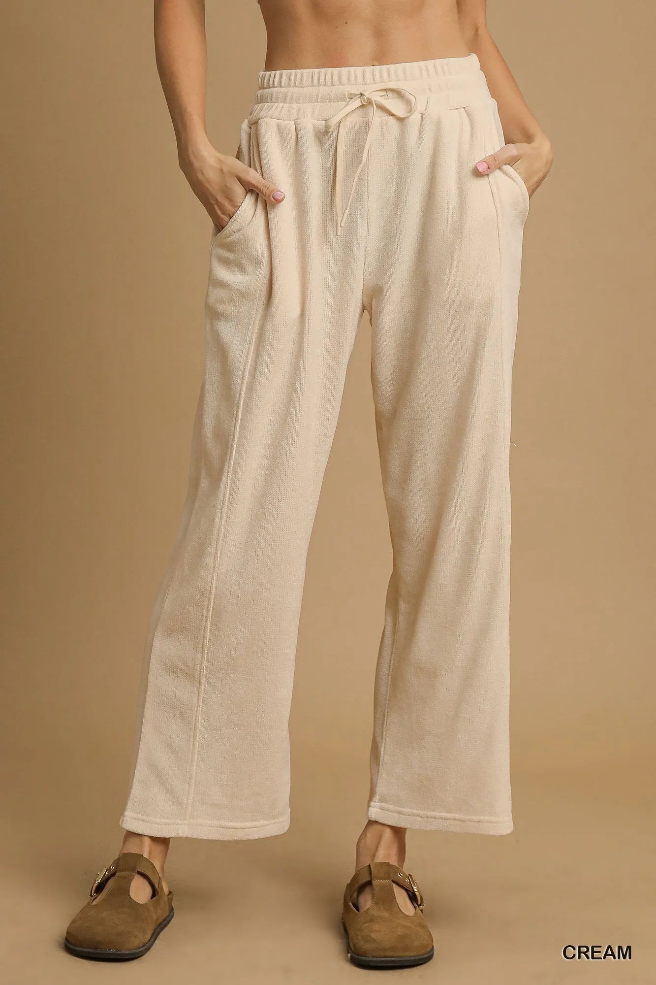 Cream Umgee drawstring wide-leg pants from Trendsi, featuring a relaxed fit and comfortable fabric.