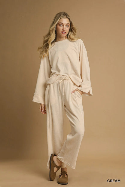 Cream Umgee drawstring wide-leg pants from Trendsi, featuring a relaxed fit and comfortable waistband.
