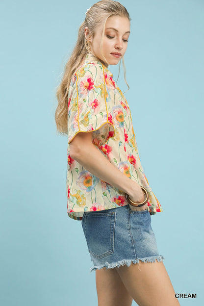 Cream floral print Umgee button-down blouse with flutter sleeves, stylish and lightweight for casual or dressy wear.