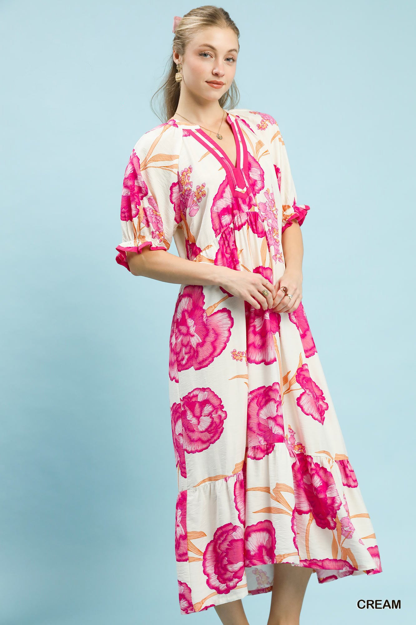 Cream floral print midi dress by Umgee with contrast trim, featuring a flowy silhouette and feminine design.