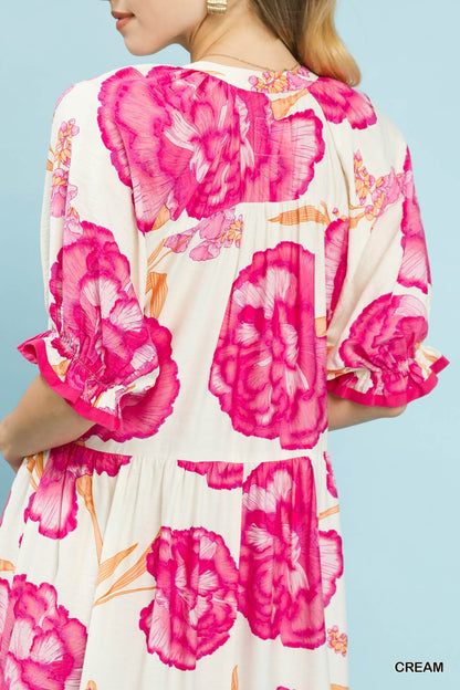 Cream floral print midi dress by Umgee with contrast trim, featuring a flowy silhouette and feminine style.