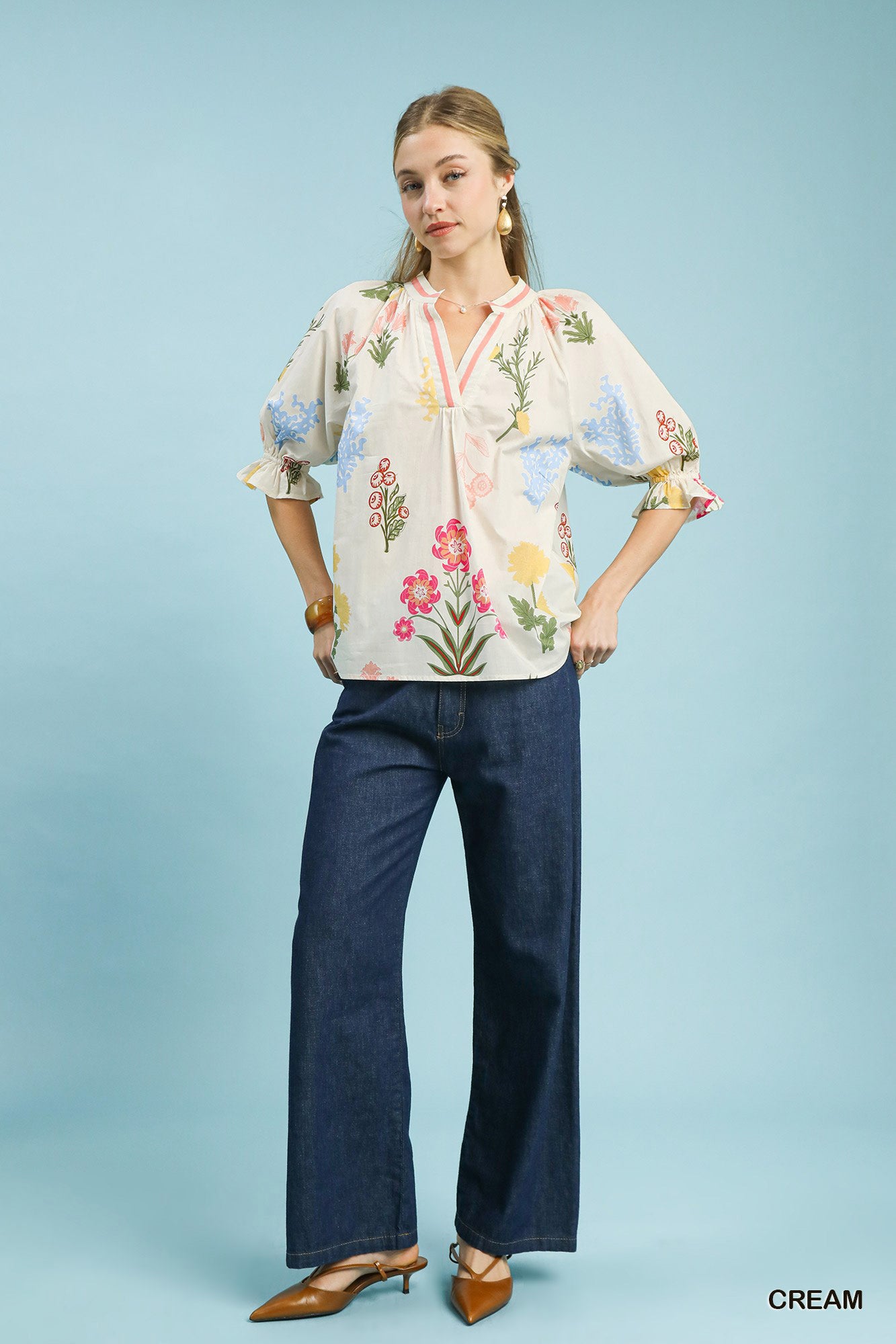 Cream floral split neck puff sleeve top by Umgee featuring a relaxed fit and feminine design.