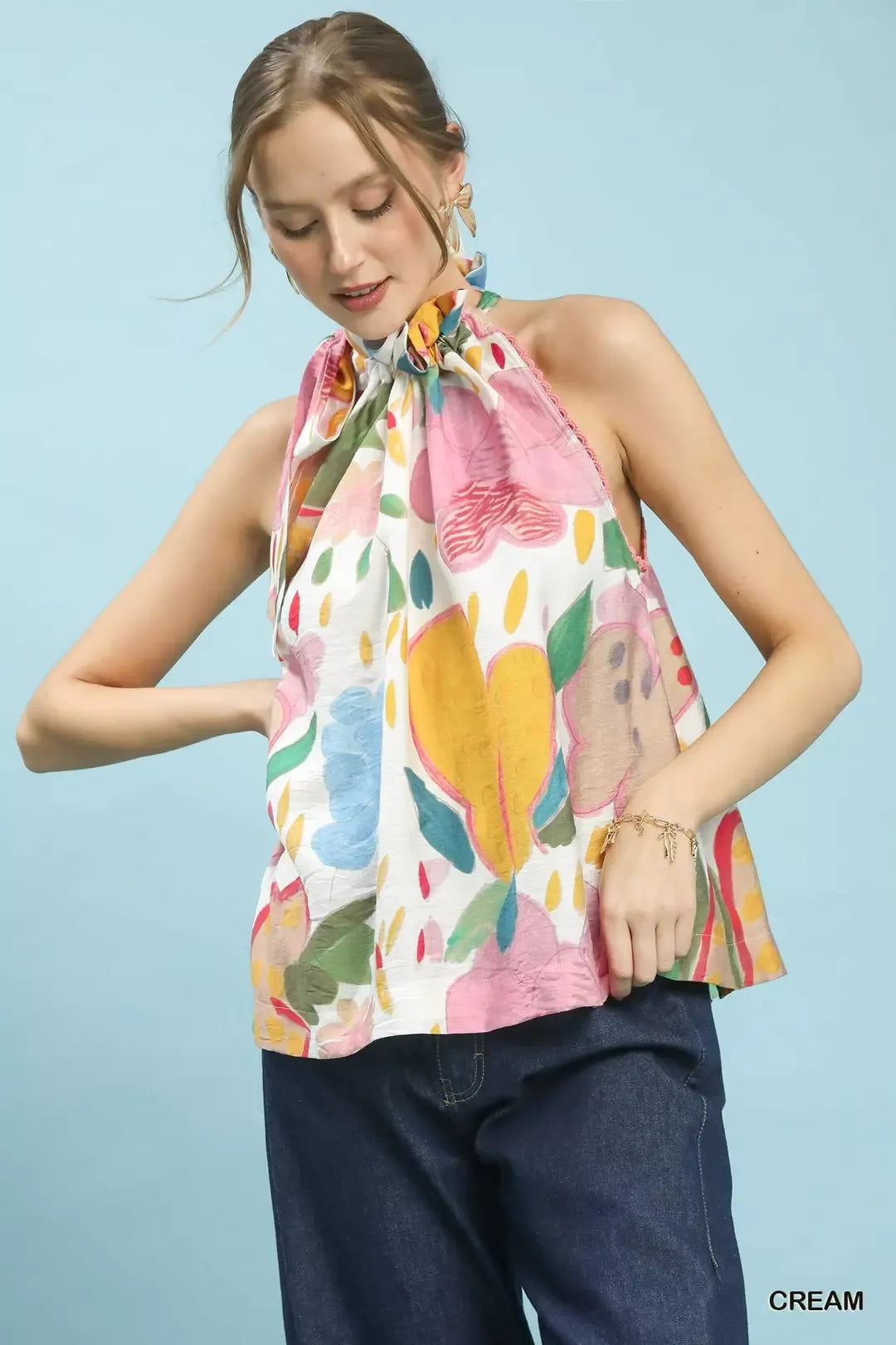 Multi-color floral halter neck boho top by Umgee featuring a relaxed fit and vibrant floral pattern.