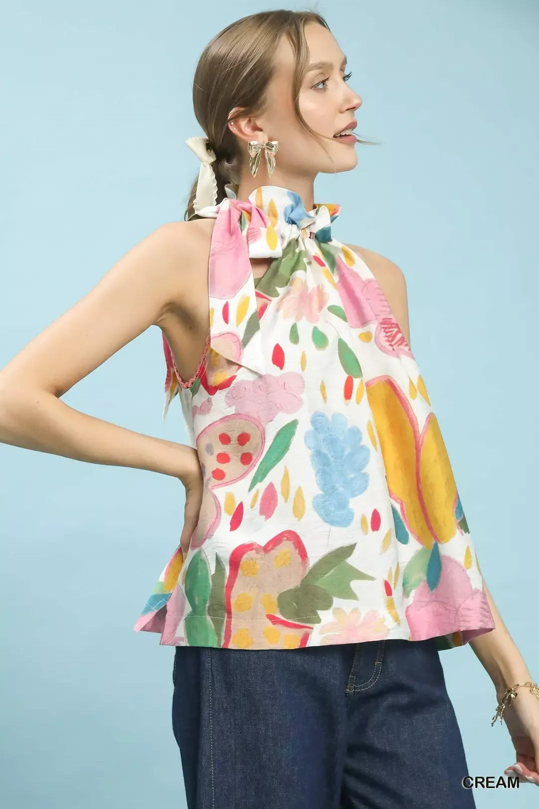 Multi-color floral boho halter neck top by Umgee featuring a relaxed fit and vibrant flower pattern, perfect for casual summer styles.