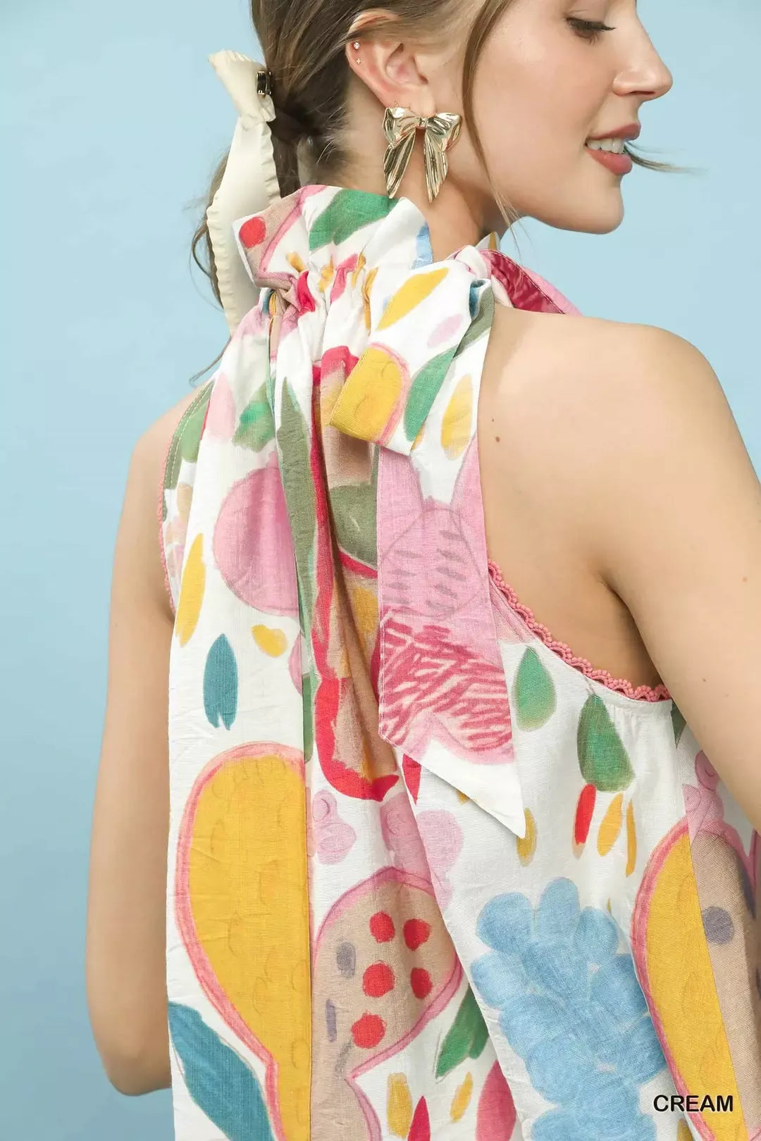Multi-color floral boho top by Umgee featuring a halter neck, perfect for a trendy, relaxed summer look.