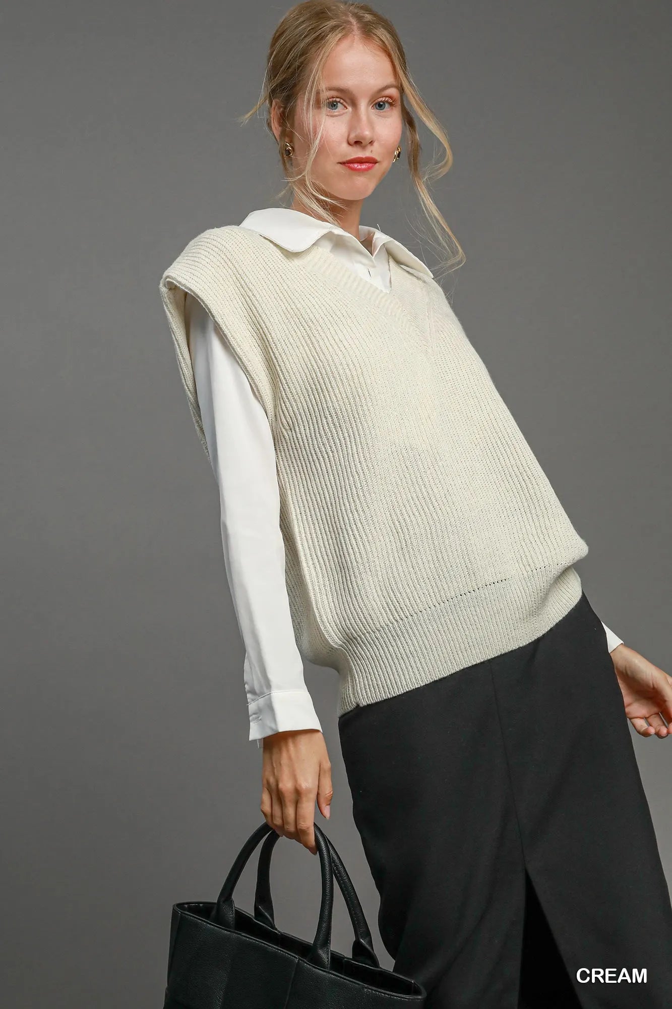 Cream oversized V-neck vest by Umgee, shown on a model, featuring a relaxed fit and soft fabric for casual styling.