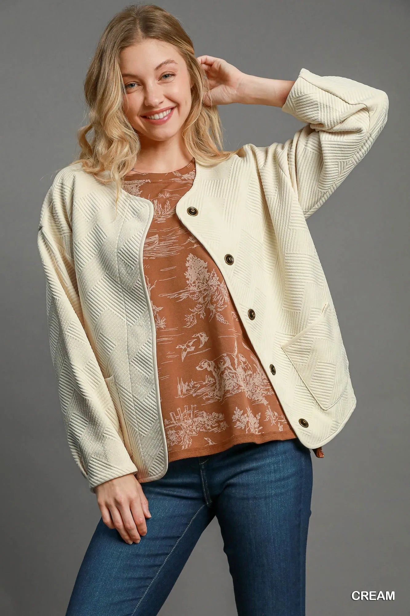 Cream Umgee Textured Jacquard Jacket by Trendsi, shown with intricate woven pattern and tailored fit on a model.
