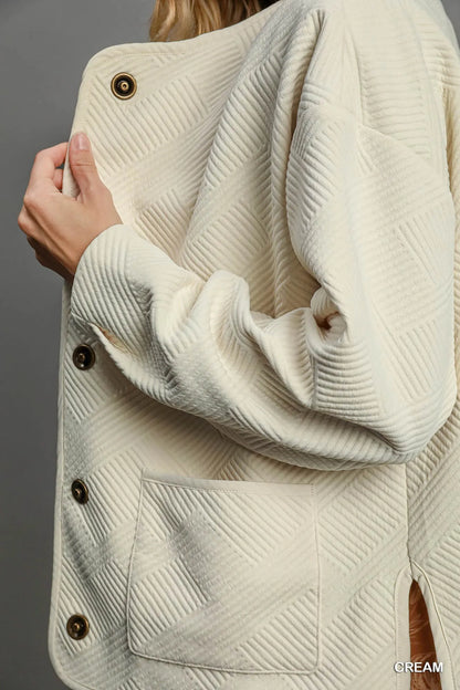 Cream textured Jacquard jacket by Umgee, featuring a stylish, woven design and tailored fit for a fashionable layered look.