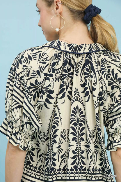Cream Umgee Two Tone Border Print Top with long sleeves and relaxed fit, featuring a stylish contrasting border design.