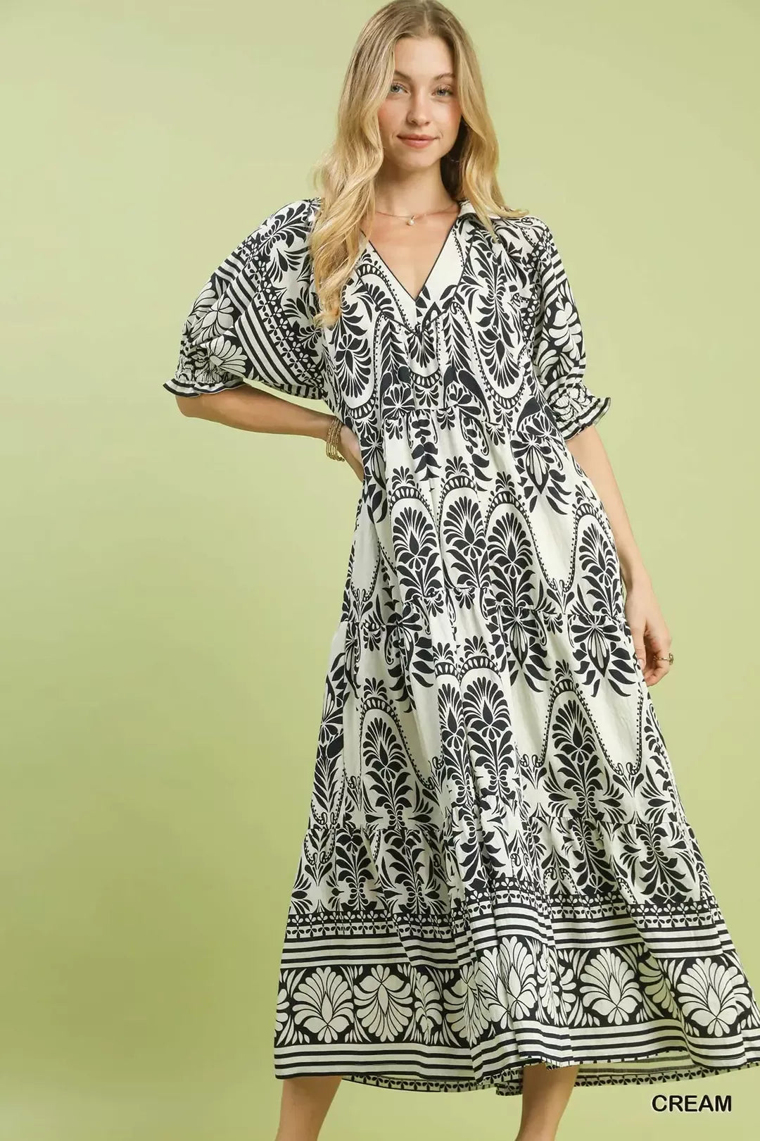 Cream Umgee two-tone border print midi dress with short sleeves and flowing silhouette, perfect for casual or semi-formal wear.