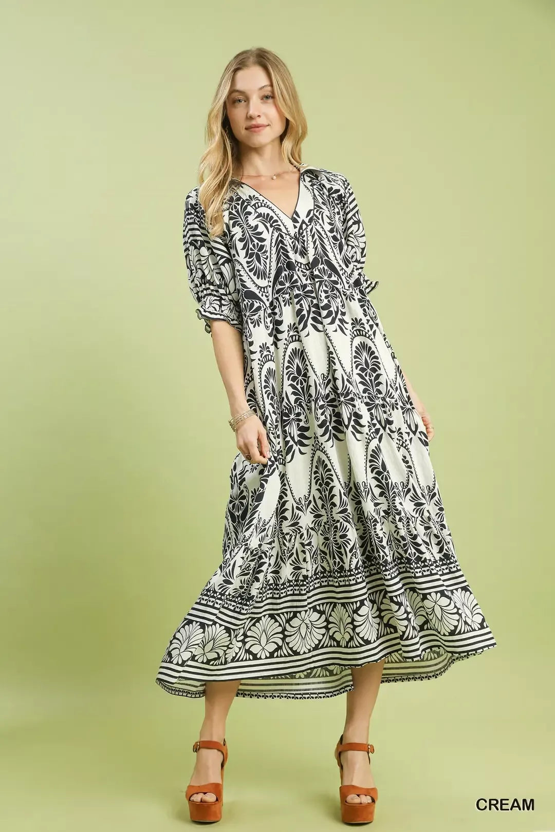 Cream Umgee two-tone border print midi dress with short sleeves and relaxed fit, perfect for casual or semi-formal occasions.