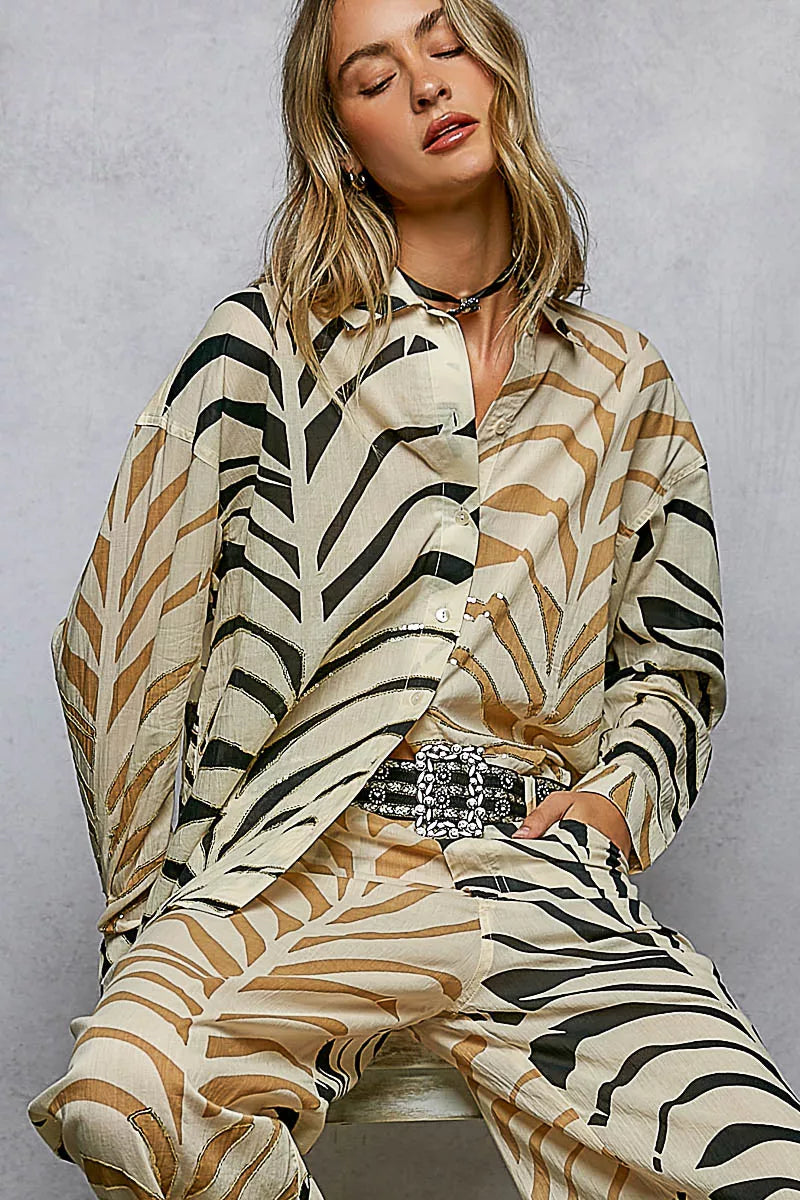 Cream and zebra-print two-tone woven long sleeve shirt with spangle details from Trendsi, featuring a stylish printed design.