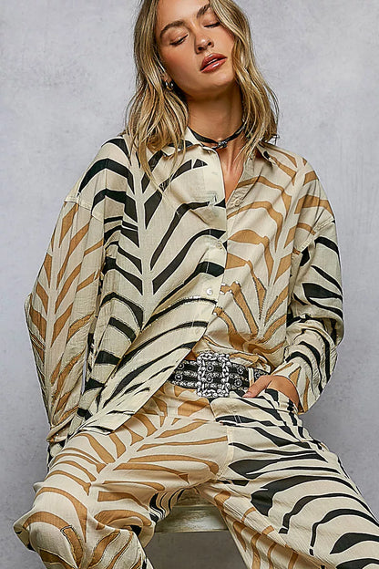 Cream and zebra-print two-tone woven long sleeve shirt with spangle details from Trendsi, featuring a stylish printed design.