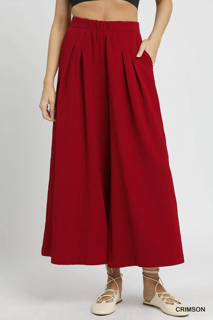 Crimson Umgee wide leg pants with elastic waist and relaxed fit, stylish women's fashion pants from Trendsi.