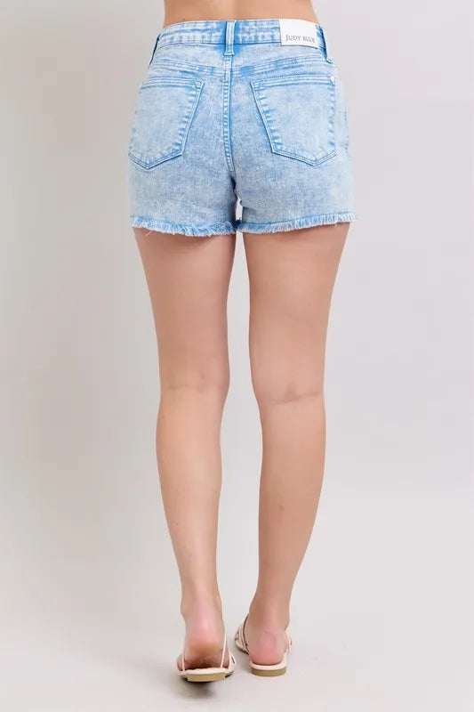Plus size Judy Blue denim shorts with mid-rise, garment-dyed fabric, in a vibrant cyan color, perfect for casual summer wear.