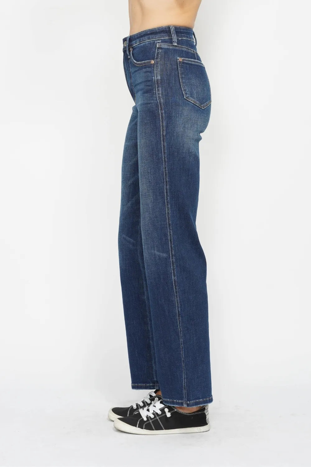 Dark wash Judy Blue high waist tummy control jeans displayed on a model, showcasing the fitted style and flattering silhouette.