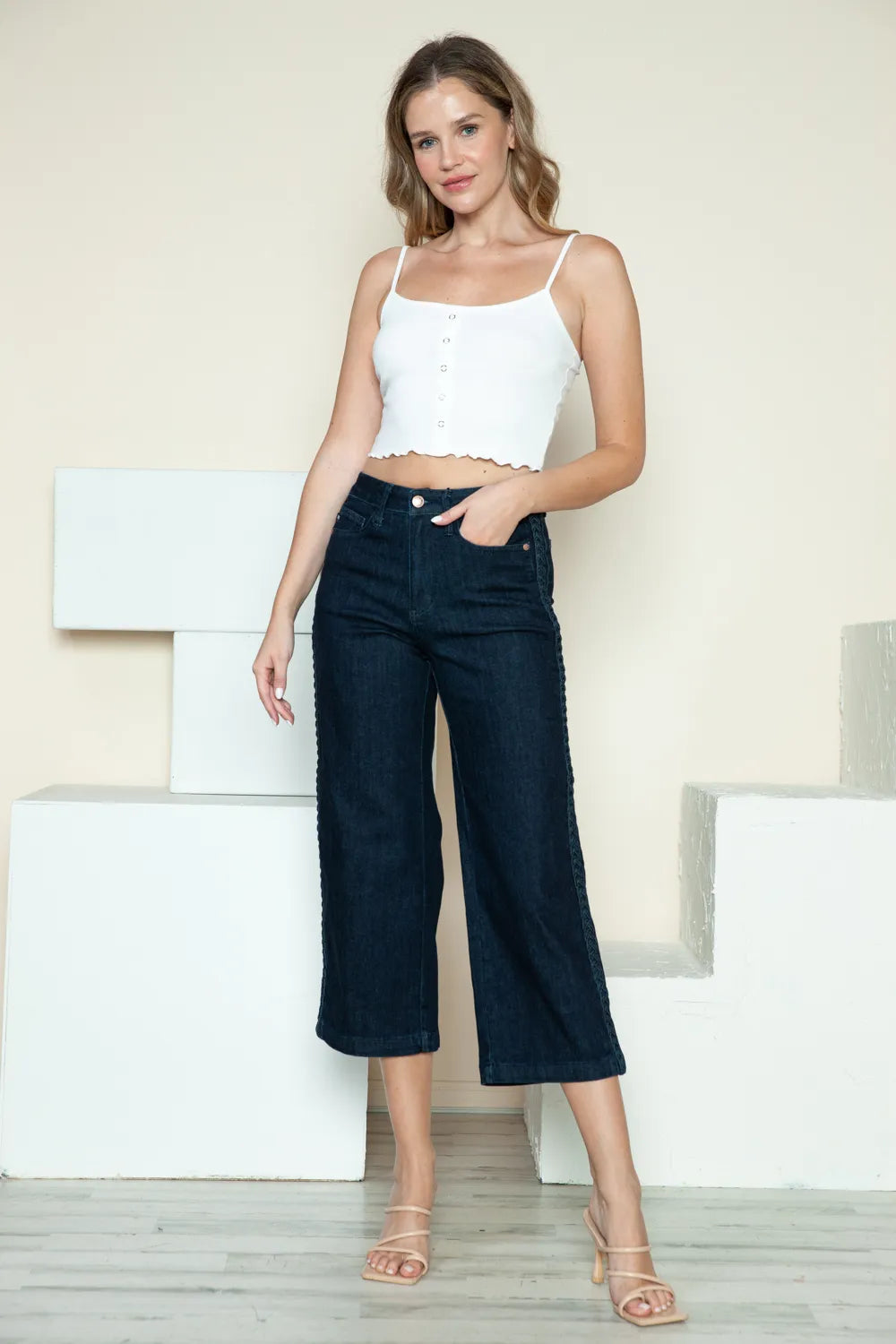 Dark Judy Blue full-size crop wide-leg jeans with side seam braid detail, showcasing a stylish casual look.