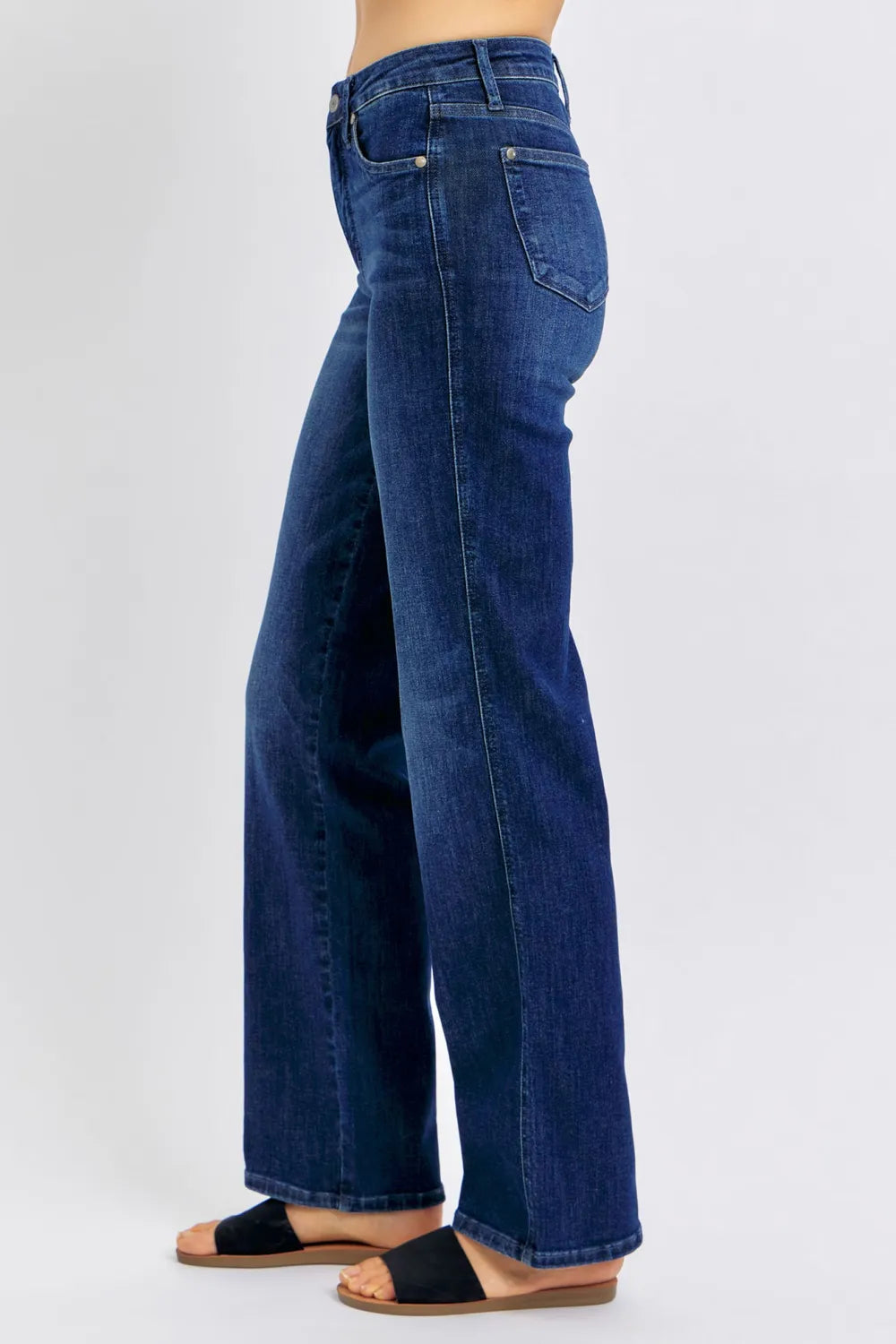Dark wash Judy Blue full-size straight jeans with tummy control, designed for plus size women, by Trendsi.