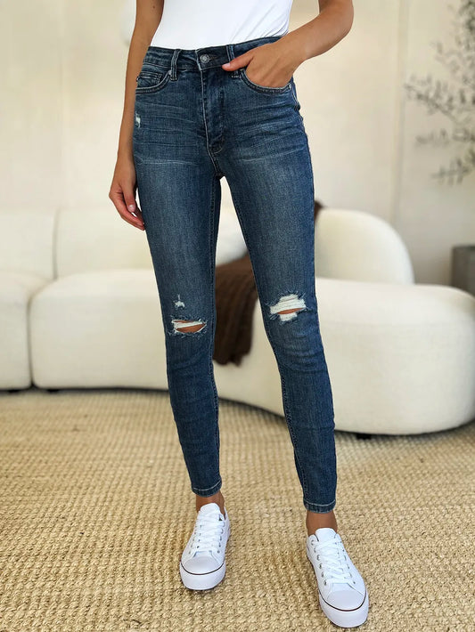 Dark Judy Blue full-size mid-waist distressed slim jeans with ripped details and a fitted silhouette.