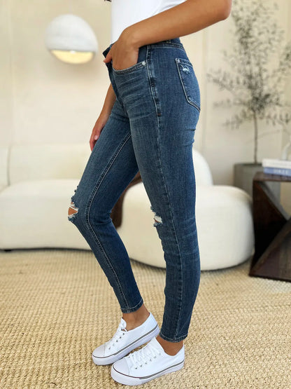 Dark Judy Blue full-size mid-waist distressed slim jeans with frayed detailing and a fitted silhouette, designed for a stylish casual look.