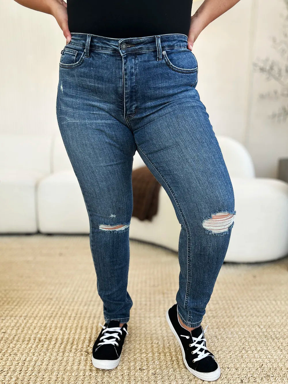 Dark Judy Blue full-size mid-waist distressed slim jeans with ripped details, shown on a model.