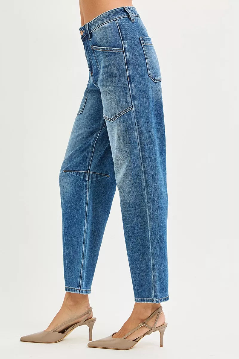 Dark RISEN 4-way stretch mid-rise barrel jeans by Trendsi with patch pockets and relaxed fit, displayed hanging against a white background.