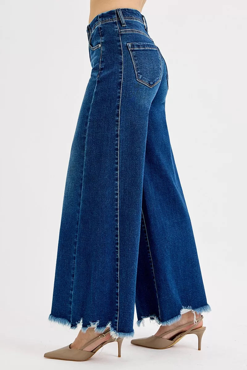 Dark wash Risen full-size high-rise ankle wide jeans by Trendsi, shown on a model, with a relaxed fit and stylish design.
