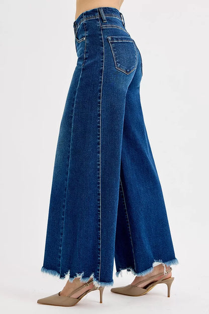 Dark wash Risen full-size high-rise ankle wide jeans by Trendsi, shown on a model, with a relaxed fit and stylish design.