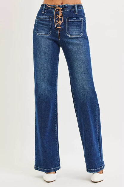 Dark wash Risen plus size high-rise wide-leg jeans with front tie detail, styled for a relaxed, trendy look.