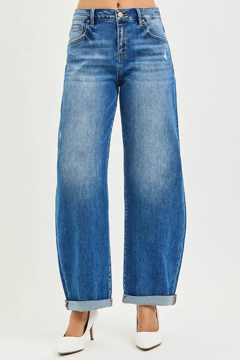 Plus size RISEN dark denim full-size mid-rise barrel jeans with double roll-up cuffs, styled casually.