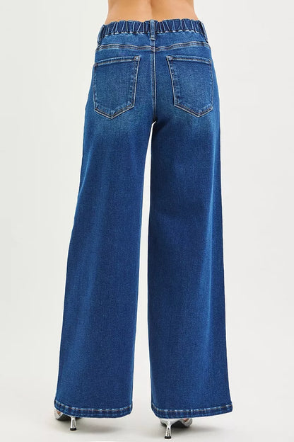 Dark-colored Risen full-size mid-rise wide side pintuck jeans with front drawstring and plus size fit, styled with casual elegance.