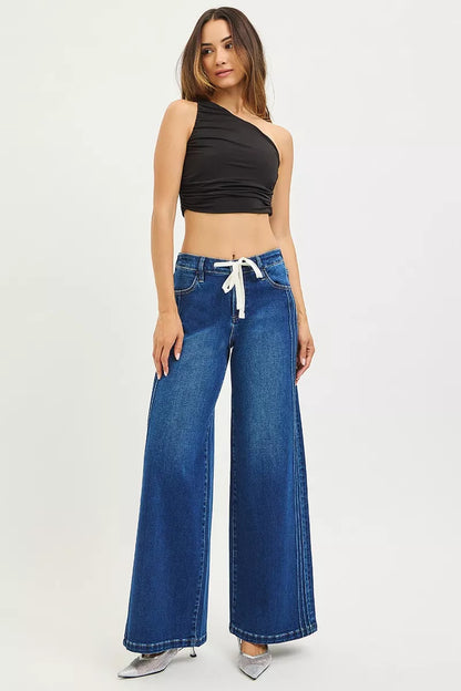 Dark blue RISEN full size mid-rise wide-leg pintuck jeans with front drawstring, plus size, by Trendsi.