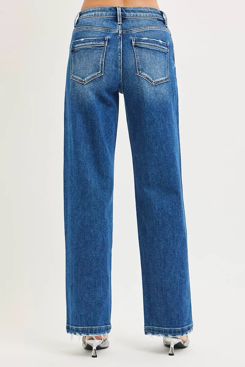 Dark blue RISEN full-size slouchy baggy jeans with side seam pockets and relaxed fit, styled by Trendsi.