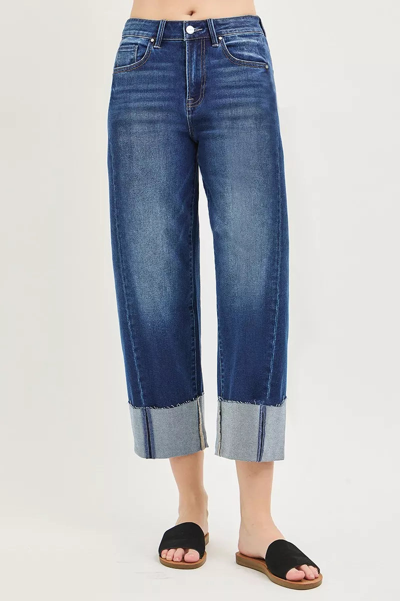 Dark plus size RISEN full size slouchy crop barrel cuffed jeans by Trendsi, showing the relaxed fit and rolled cuffs.
