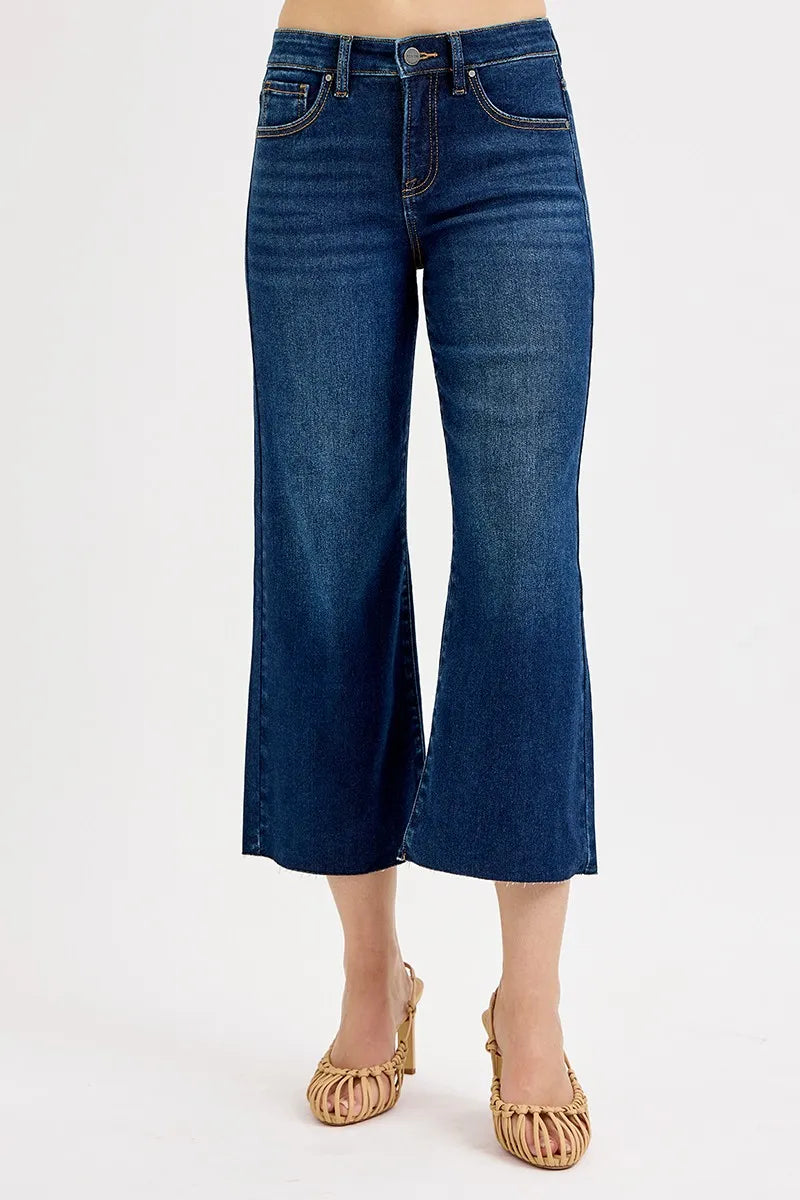 Dark wash RISEN plus size high-rise crop wide jeans with tummy control and full size fit, styled for a trendy, comfortable look.