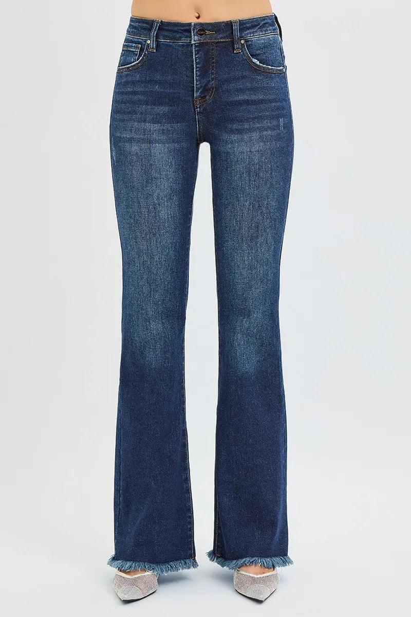 Dark wash RISEN plus size flare jeans with tummy control, mid-rise fit and classic style, designed for comfortable, flattering wear.