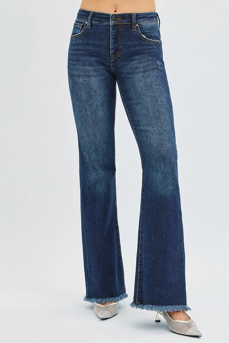 Dark wash Risen plus size flare jeans with tummy control, mid-rise fit and classic denim style from Trendsi.