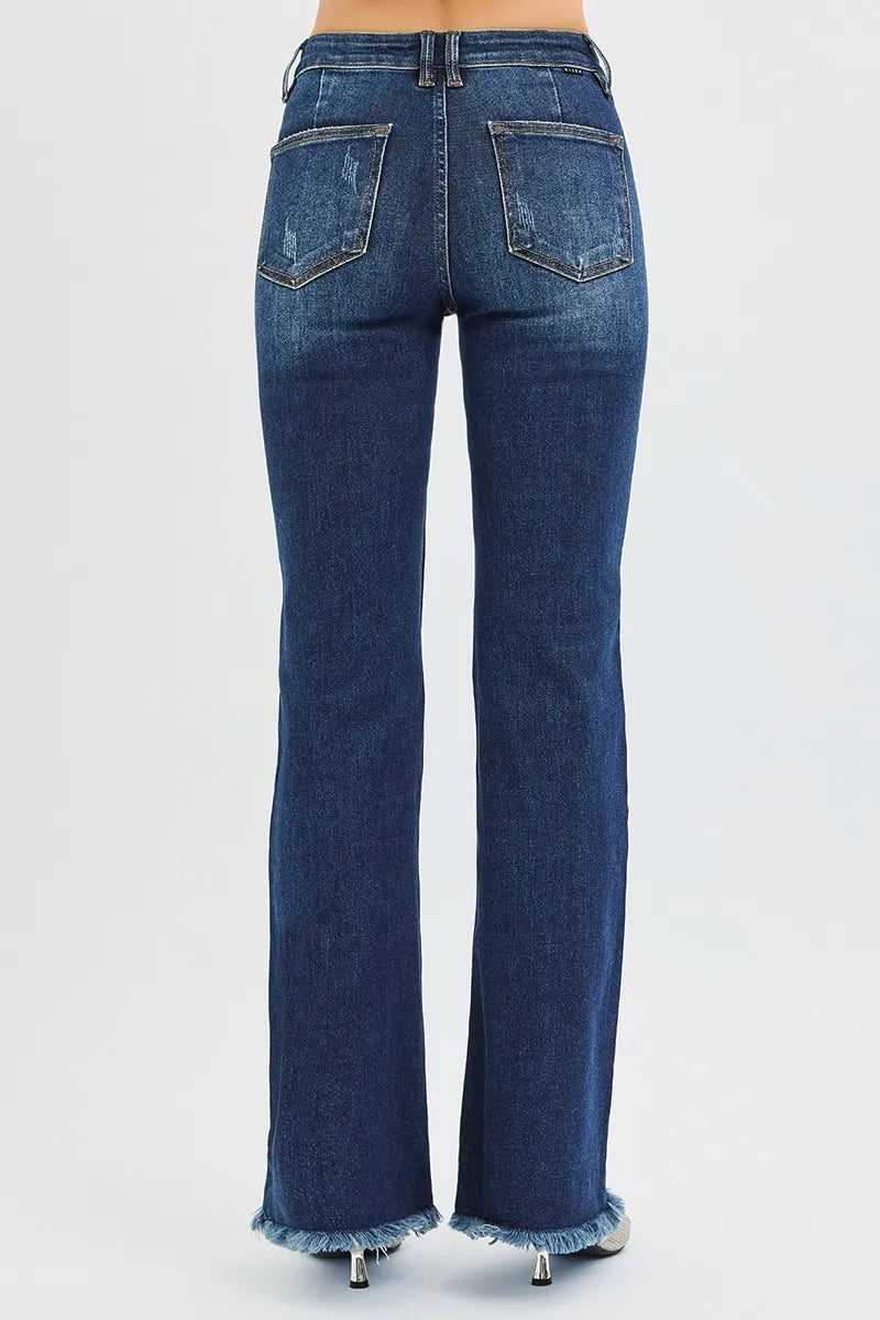 Dark wash Risen full size tummy control mid-rise flare jeans by Trendsi, plus size denim with a fitted waist and flared legs.