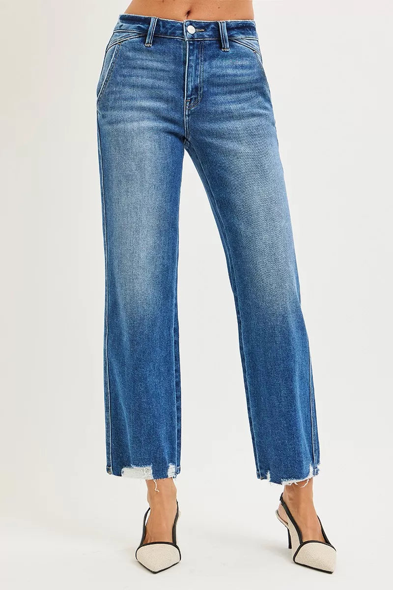 Dark blue Risen High Rise Ankle Straight Jeans with distressed hem and classic fit, displayed on a neutral background.