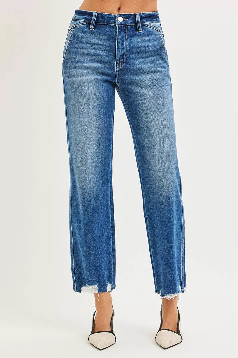 Dark wash RISEN high-rise ankle straight jeans with distressed hem detail, from Trendsi, styled on a model.