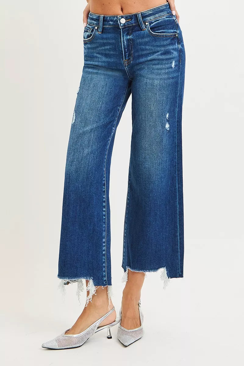 Dark wash Risen high-rise crop wide-leg jeans from Trendsi, showing the relaxed fit and stylish design on a model.