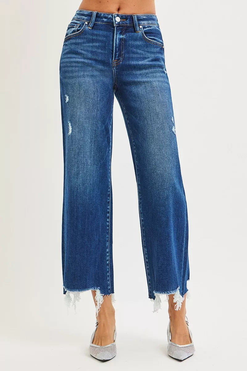 Dark wash RISEN high-rise crop wide-leg jeans from Trendsi, featuring a fitted waist and relaxed wide-leg silhouette.