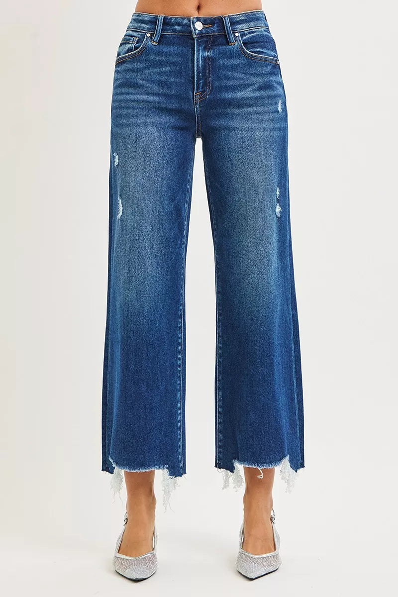 Dark wash RISEN high-rise crop wide-leg jeans from Trendsi, featuring a relaxed fit and stylish silhouette.