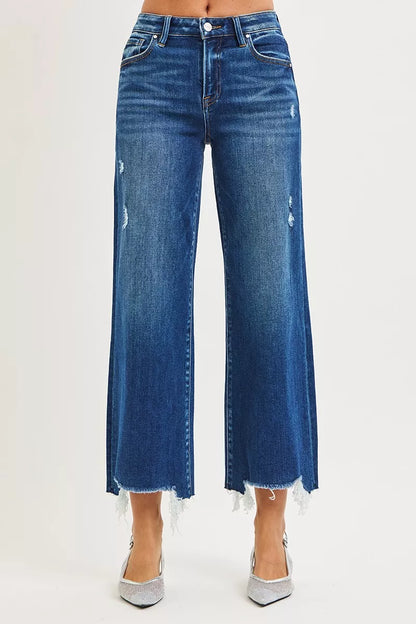 Dark wash RISEN high-rise crop wide-leg jeans from Trendsi, featuring a relaxed fit and stylish silhouette.