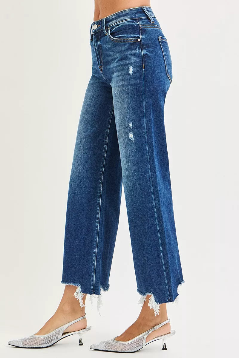 Dark wash Risen high-rise crop wide-leg jeans from Trendsi, featuring a relaxed fit and classic denim style.