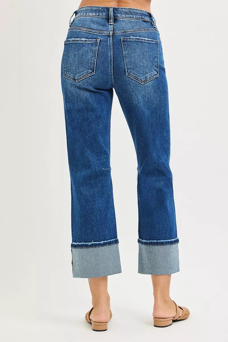 Dark blue RISEN high-rise straight jeans with distressed hem, showing front view and classic denim details.
