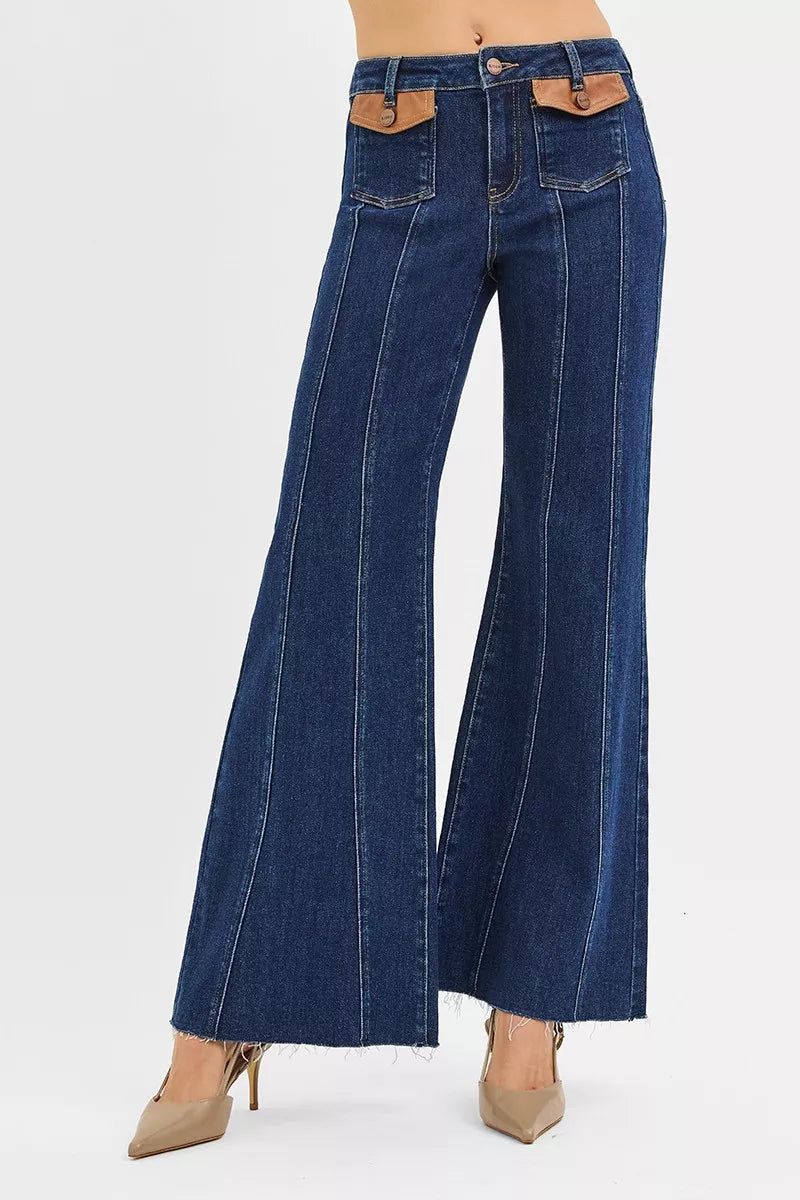 Dark RISEN high-rise wide flare jeans with front leather pocket detail, stylish denim with a trendy flare silhouette.