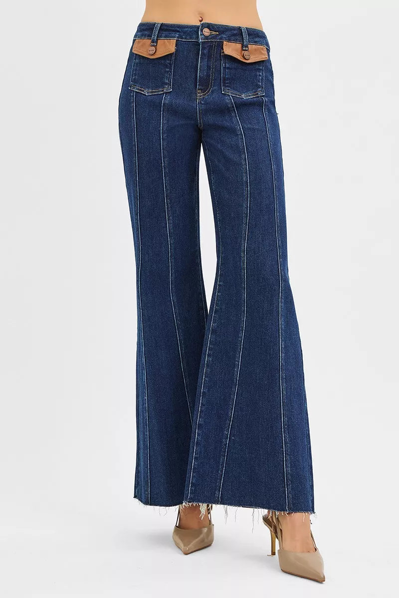Dark wash RISEN high rise wide flare jeans with front leather pocket detail, trendy and stylish for casual wear.
