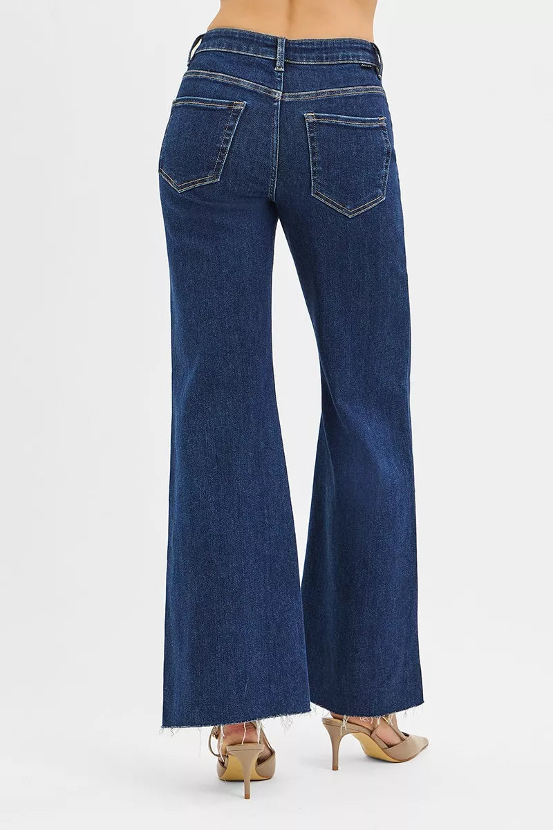 Dark Risen high-rise wide flare jeans by Trendsi featuring front leather pocket detail, stylish and comfortable denim pants.