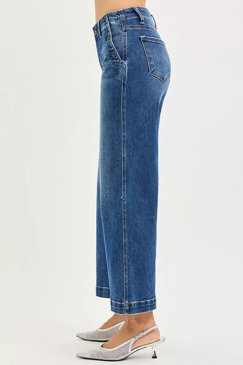 Dark wash RISEN high-rise wide-leg jeans with front pockets and button details, styled by Trendsi.